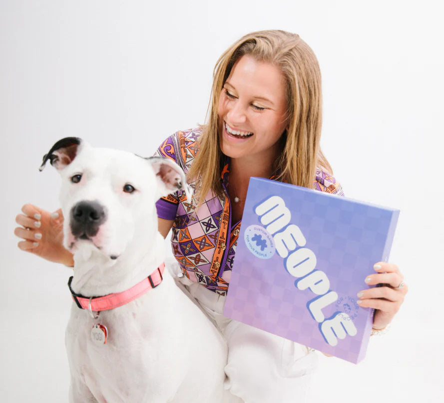 Founder of Meople with box and dog