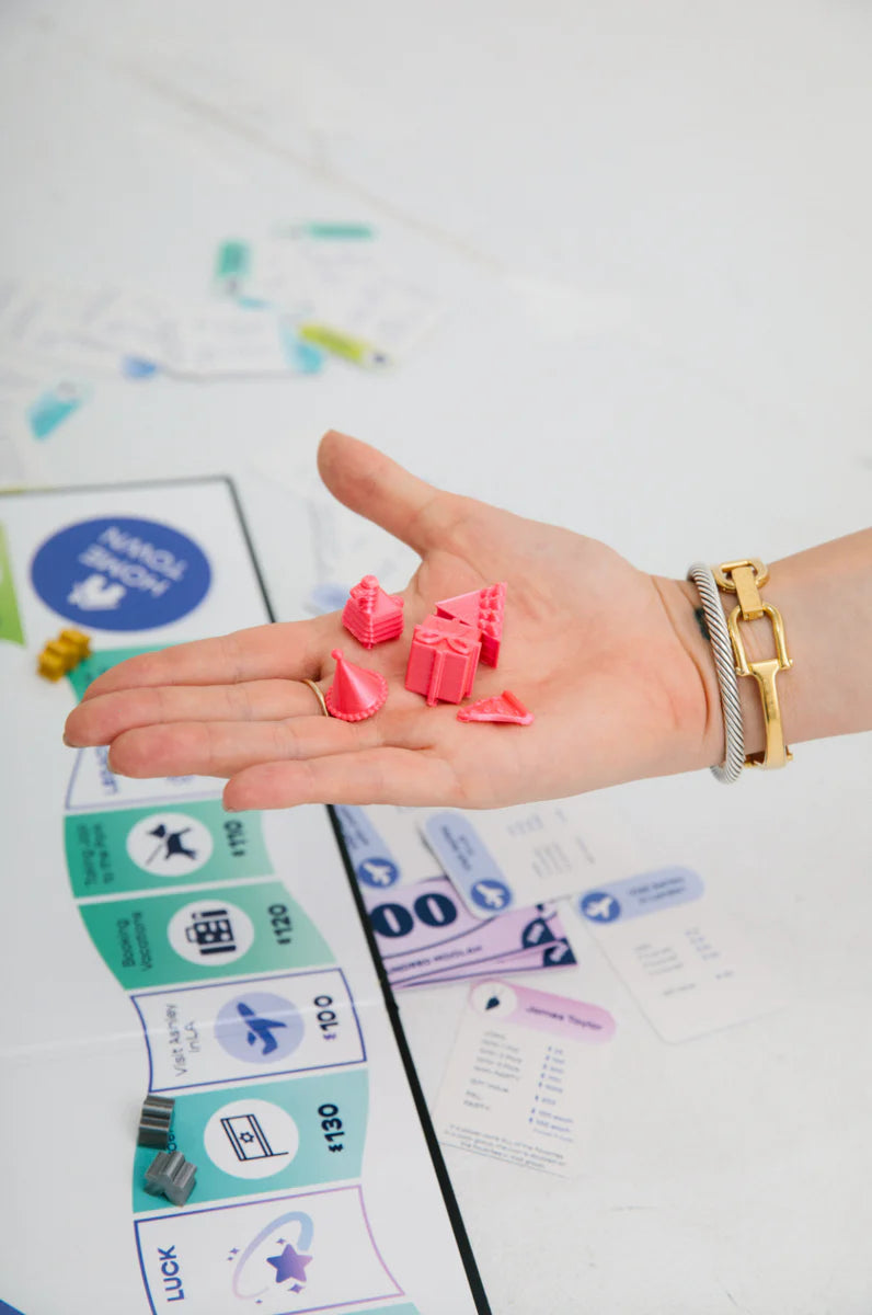 Meople player pieces in hand